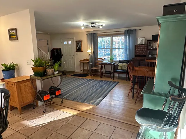a living room with furniture window and wooden floor