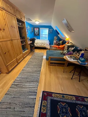 a room with furniture and a rug
