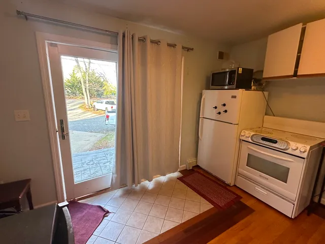 a kitchen with a refrigerator sink and stove