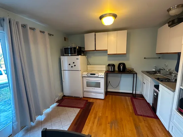 a bedroom with double bed and a window