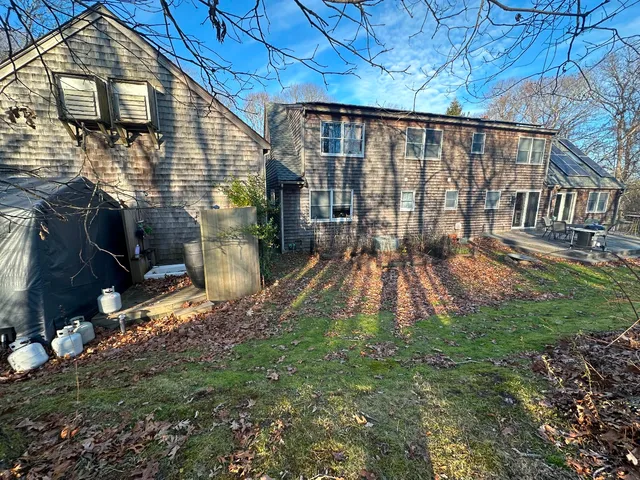 a backyard of a house with seating space