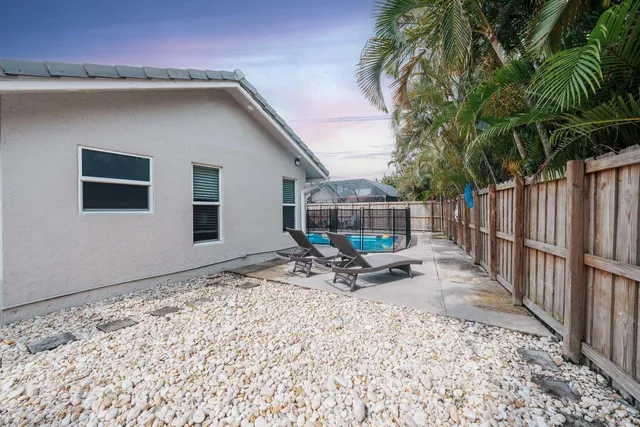 a view of a backyard with a patio