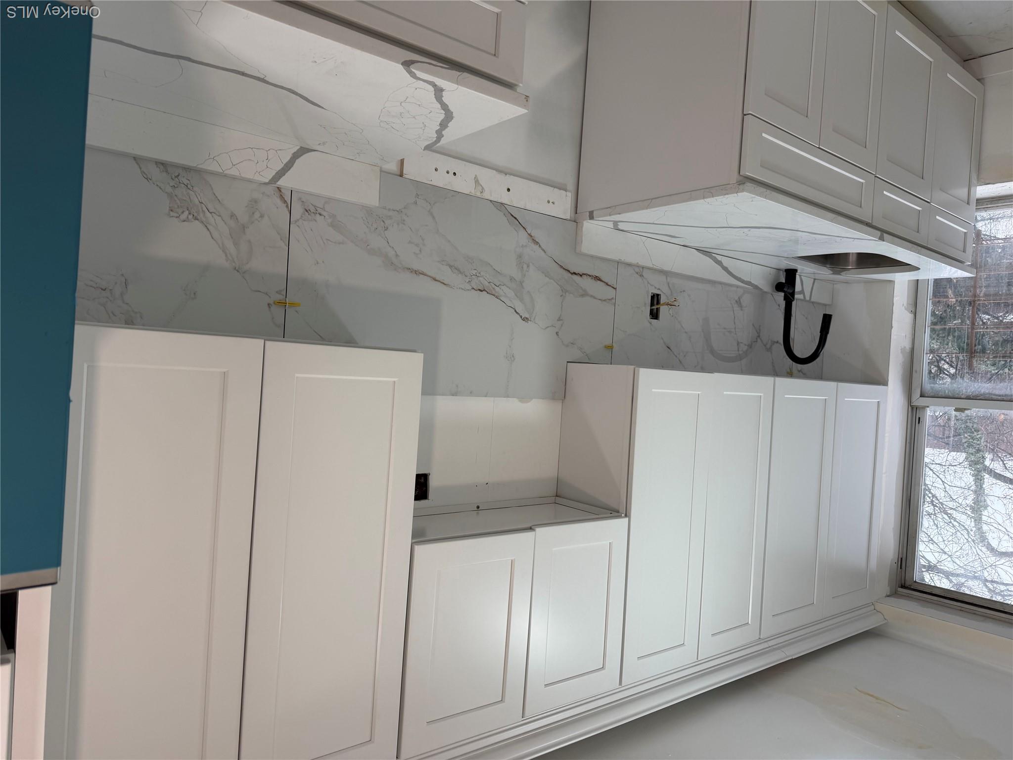 70 Howard Avenue Brooklyn, NY 11221 - Photo 4 of 8 a view of a kitchen with sink and cabinets