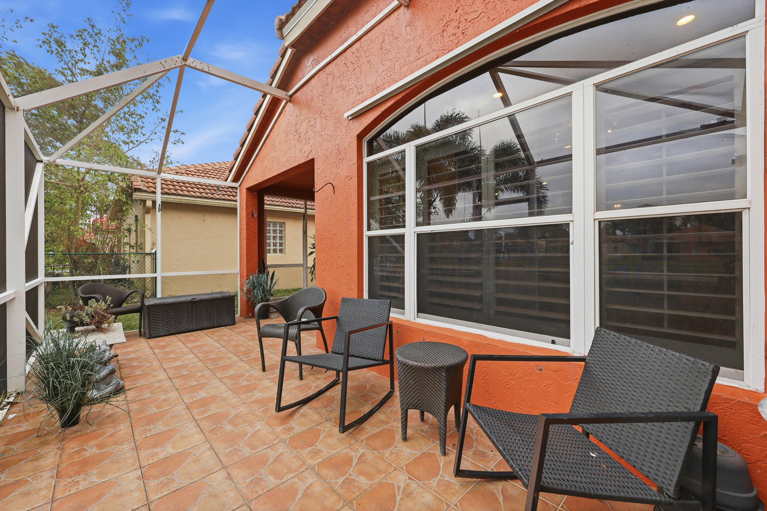 2013 Bonisle Circle Riviera Beach, FL 33418 - Photo 12 of 22 a backyard of a house with seating space