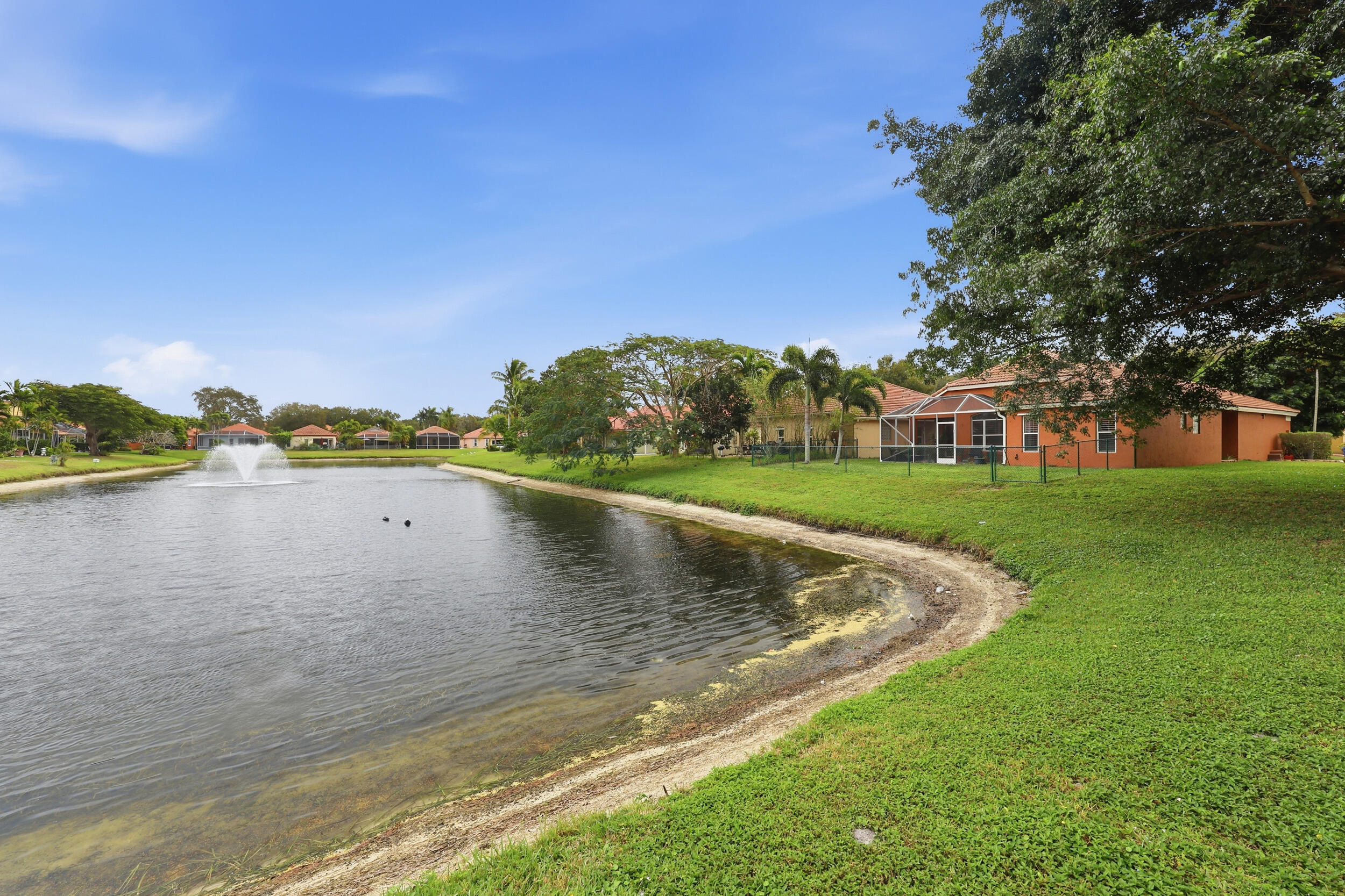 2013 Bonisle Circle Riviera Beach, FL 33418 - Photo 15 of 22 a view of a lake with houses in the background