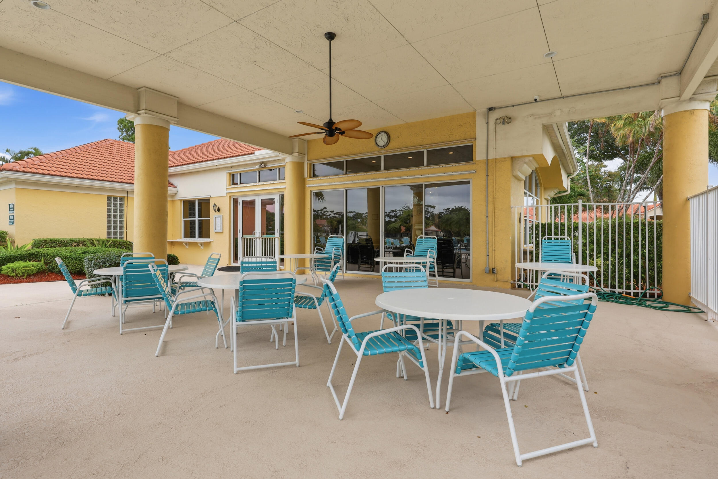 2013 Bonisle Circle Riviera Beach, FL 33418 - Photo 21 of 22 a dining room with furniture a chandelier and a floor to ceiling window