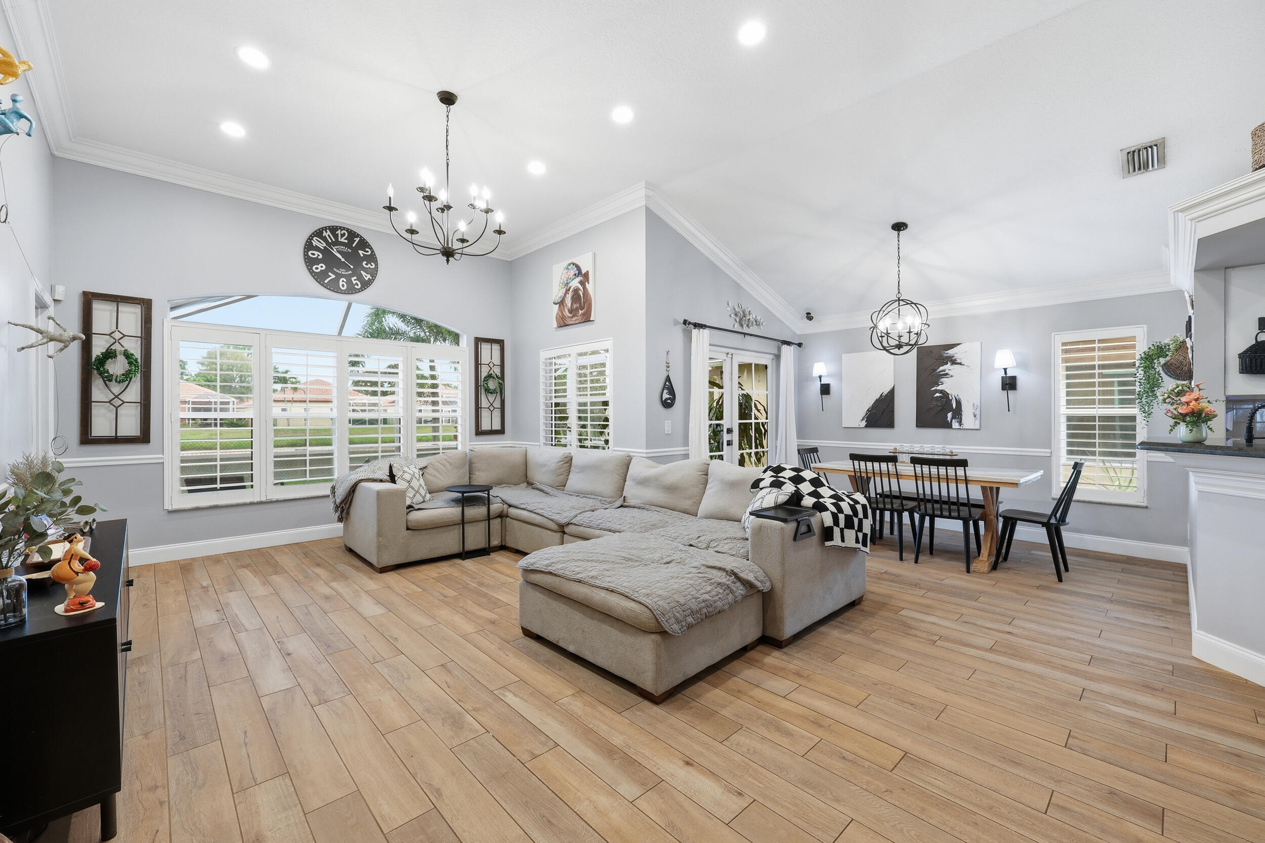 2013 Bonisle Circle Riviera Beach, FL 33418 - Photo 6 of 22 a living room with furniture chandelier and a large window