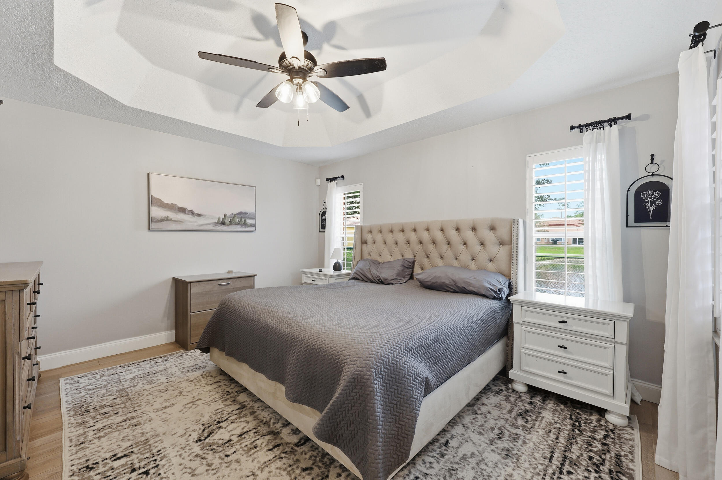 2013 Bonisle Circle Riviera Beach, FL 33418 - Photo 7 of 22 a bedroom with a bed chandelier and a window