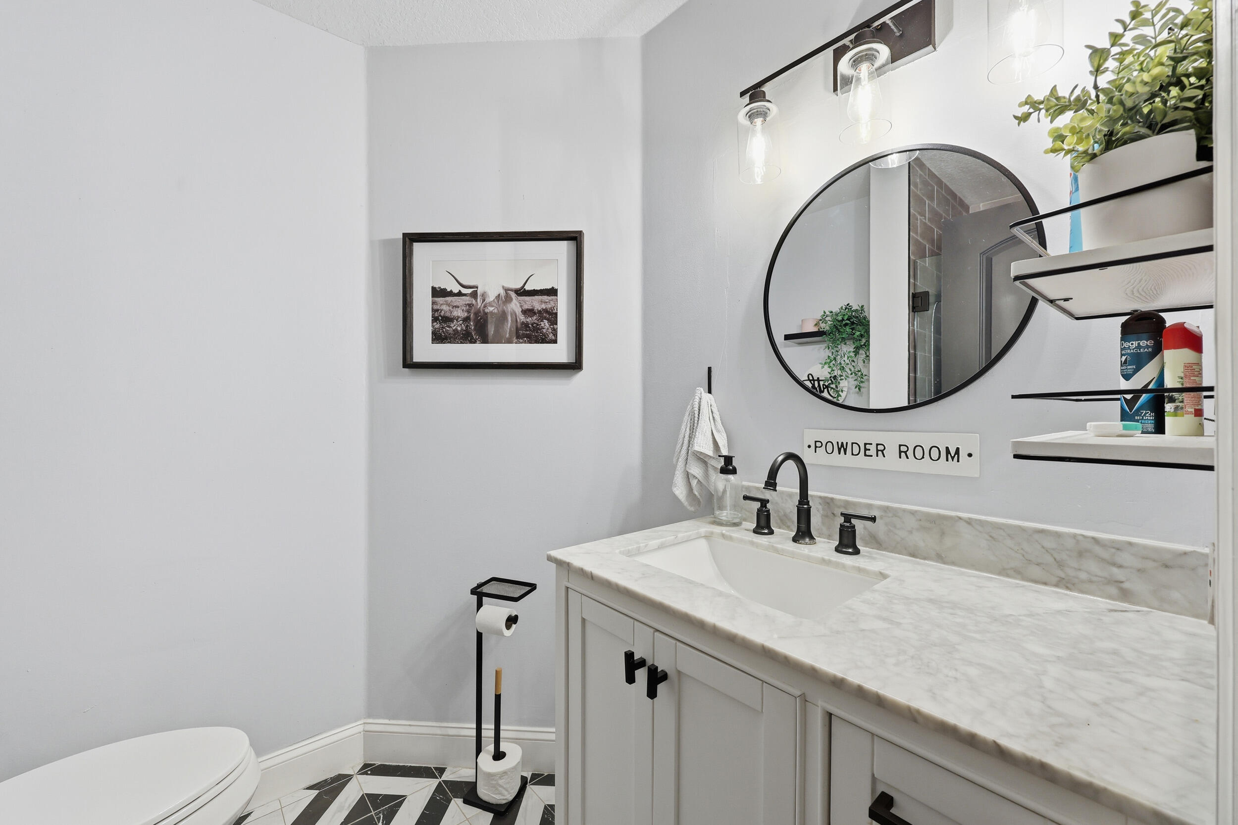 2013 Bonisle Circle Riviera Beach, FL 33418 - Photo 9 of 22 a bathroom with a sink and a mirror
