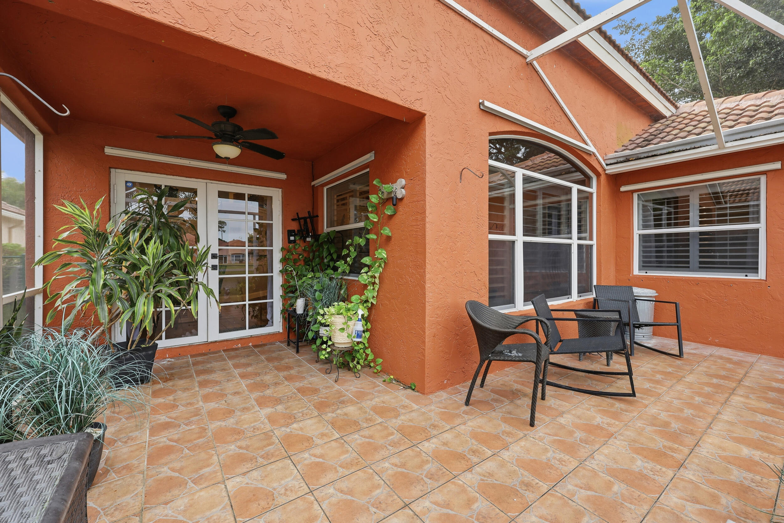 2013 Bonisle Circle Riviera Beach, FL 33418 - Photo 10 of 22 a backyard of a house with yard and outdoor seating