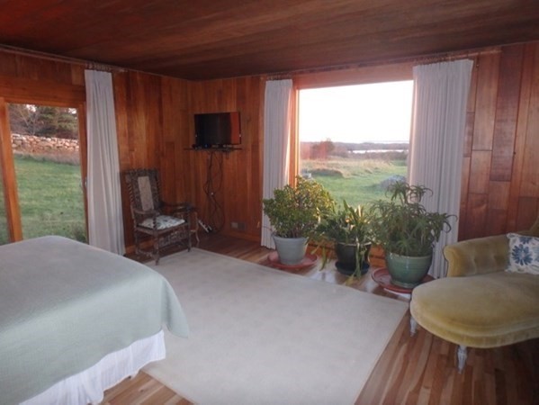 19 Lake Road Chilmark, MA 02535 - Photo 15 of 32 a bed room with a bed and a window