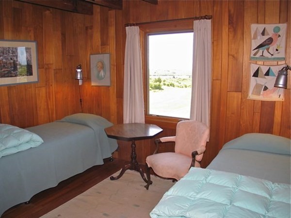 19 Lake Road Chilmark, MA 02535 - Photo 18 of 32 a bedroom with a bed and a table