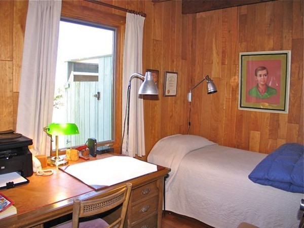 19 Lake Road Chilmark, MA 02535 - Photo 20 of 32 a bedroom with a bed and a table