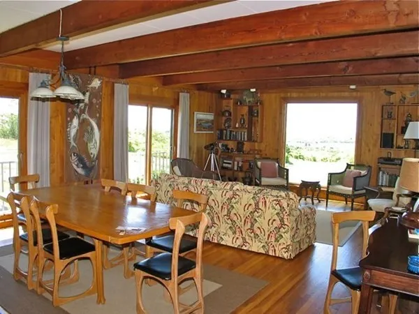a view of a dining room with furniture window and outside view
