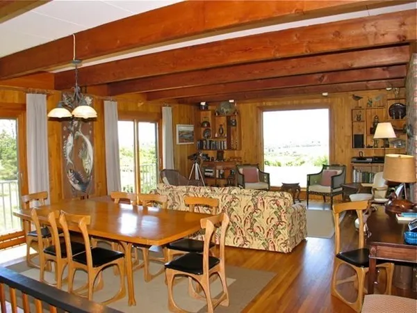 a view of a dining room with furniture window and outside view