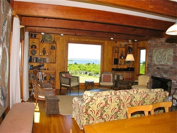 19 Lake Road Chilmark, MA 02535 - Photo 9 of 32 a living room with furniture and a fireplace