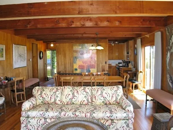 a bed sitting in a room next to a window