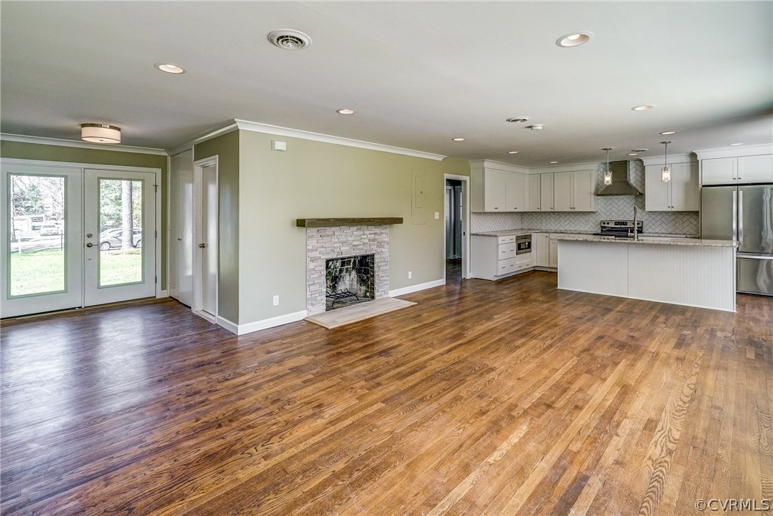 109 North Ridge Road Henrico, VA 23229 - Photo 6 of 41 a large kitchen with windows and a fireplace