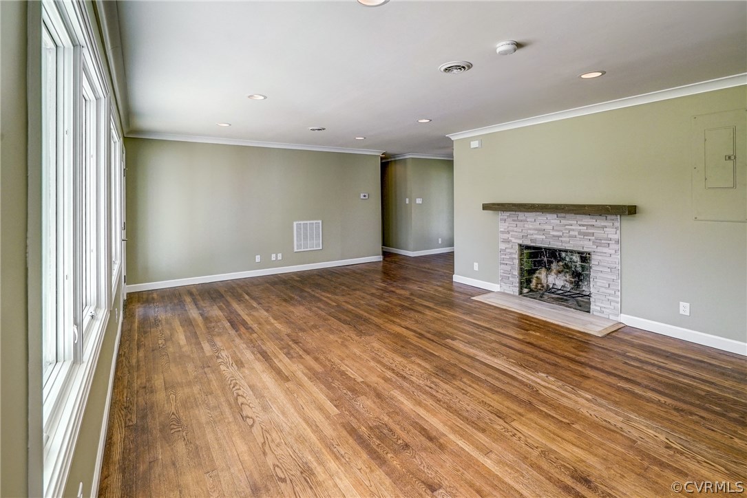109 North Ridge Road Henrico, VA 23229 - Photo 8 of 41 an empty room with wooden floor fireplace and windows