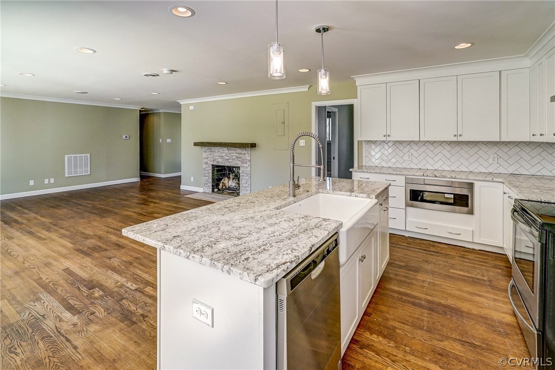 109 North Ridge Road Henrico, VA 23229 - Photo 10 of 41 a kitchen with kitchen island a sink stainless steel appliances and cabinets