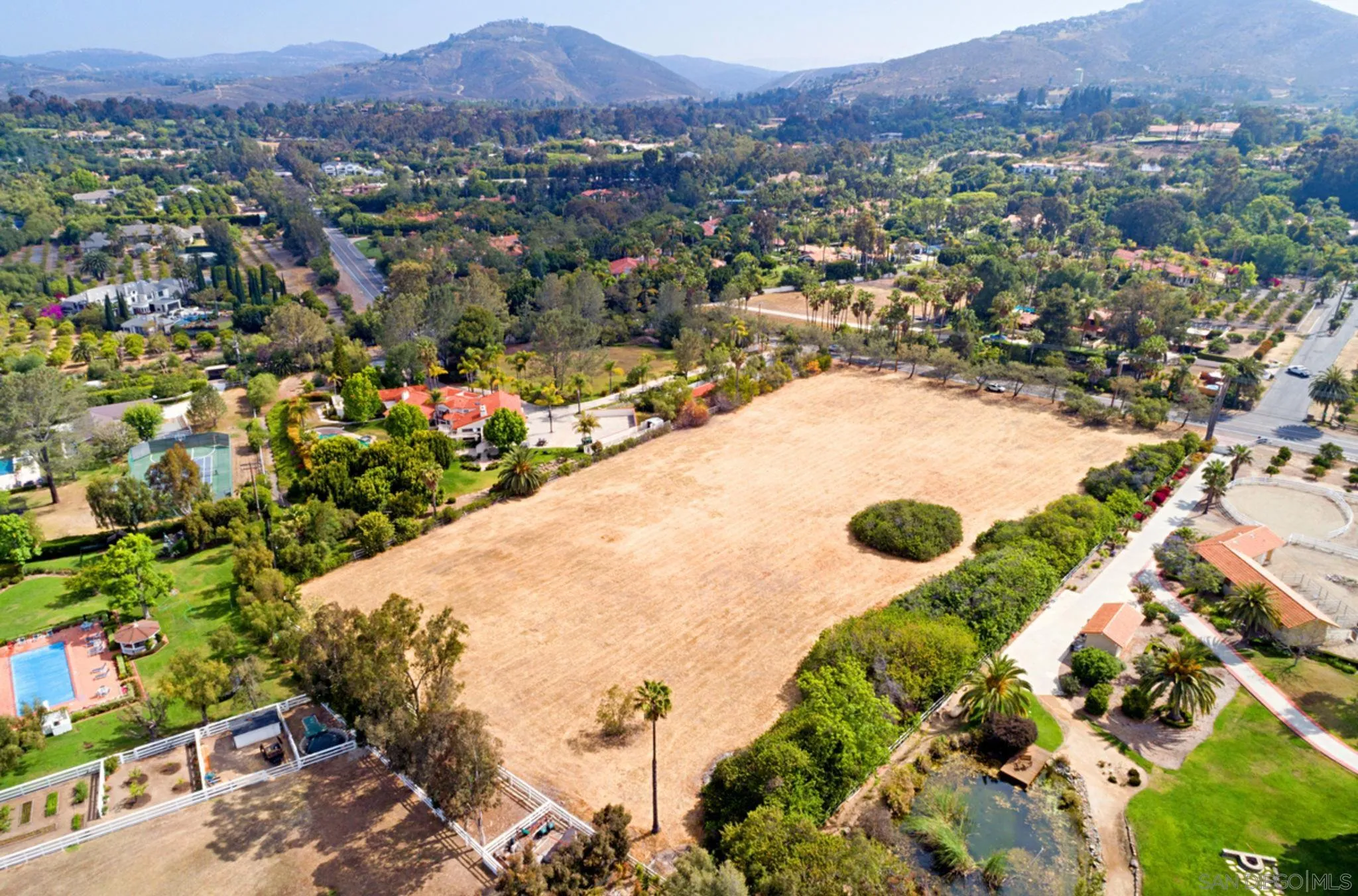 7 St Rancho Santa Fe Ca, Unit 1 Rancho Santa Fe, CA 92067 - Photo 7 of 8 an aerial view of residential houses with outdoor space