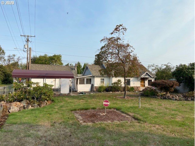 1010 L Street Springfield, OR 97477 - Photo 3 of 26 a front view of a house with a yard