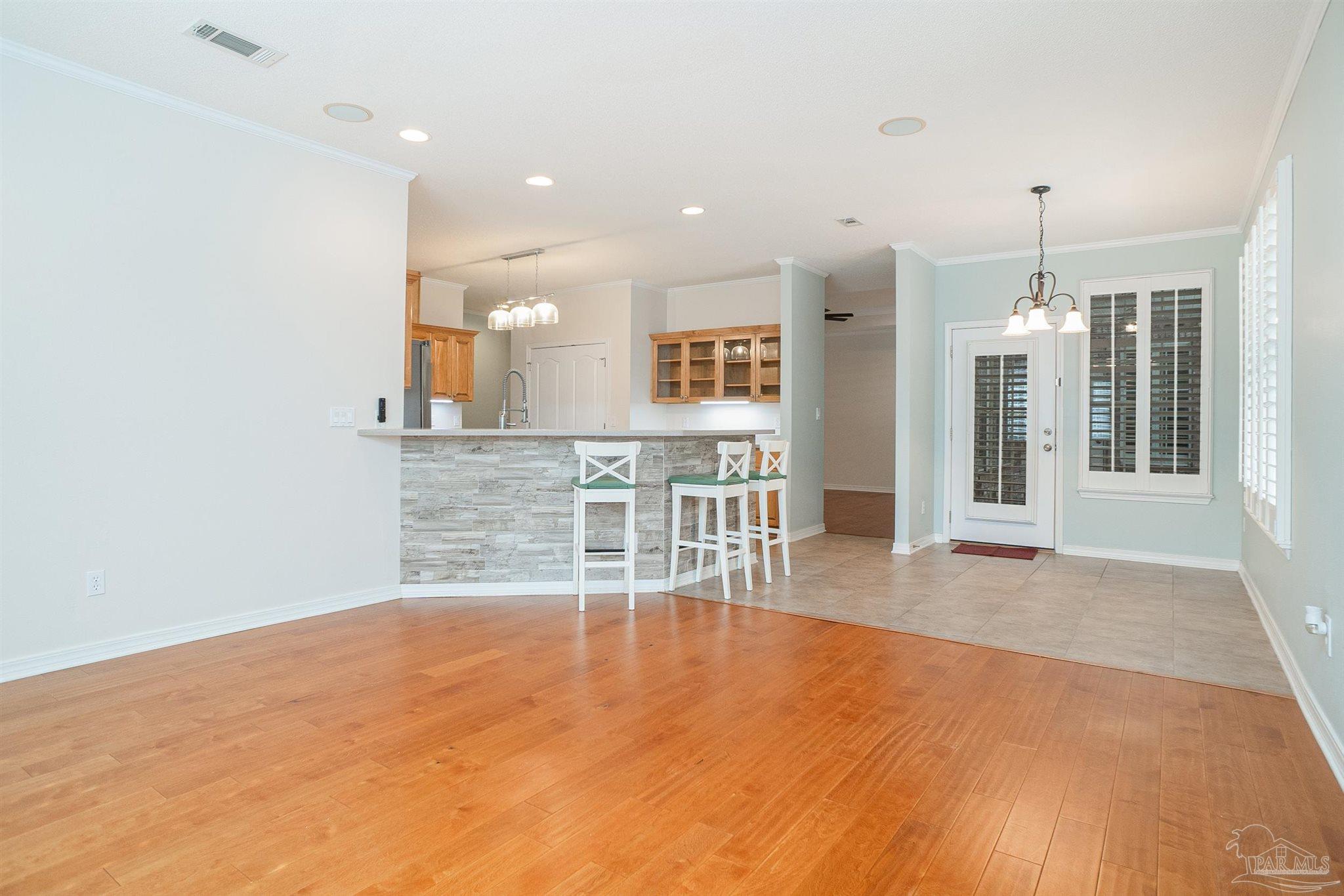 2351 Queens Ferry Lane Cantonment, FL 32533 - Photo 22 of 67 an empty room with wooden floor and windows