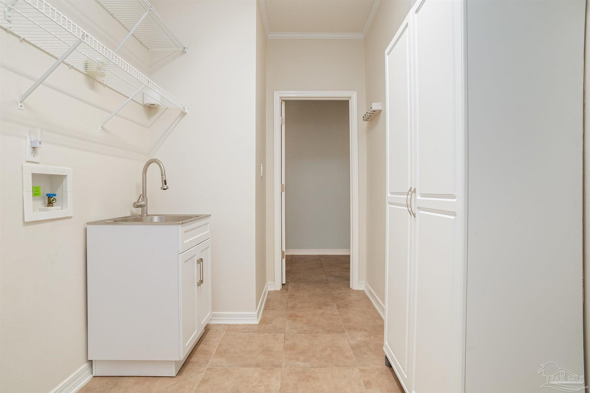 2351 Queens Ferry Lane Cantonment, FL 32533 - Photo 25 of 67 a bathroom with a sink a mirror and vanity