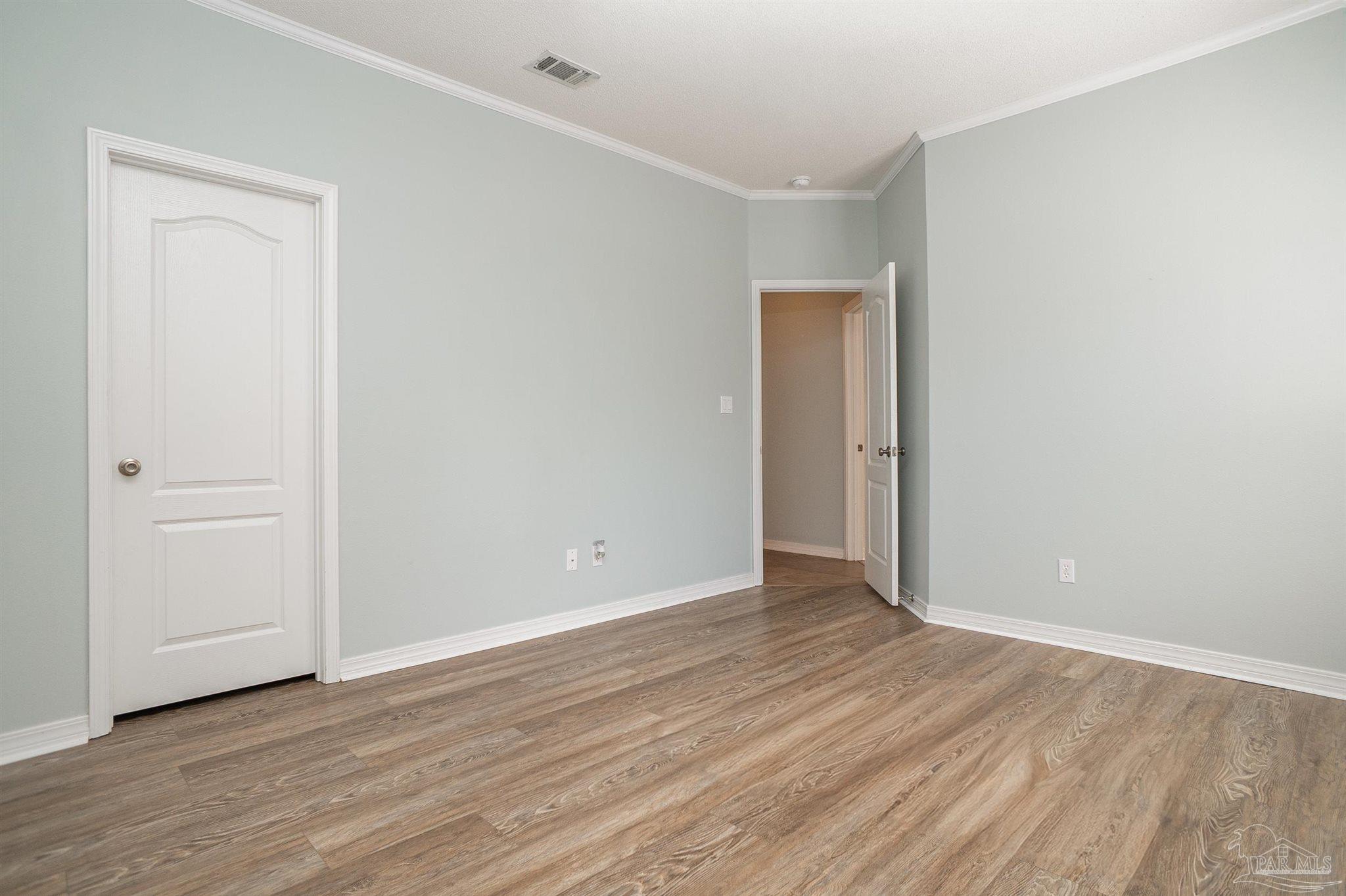 2351 Queens Ferry Lane Cantonment, FL 32533 - Photo 30 of 67 a view of an empty room with wooden floor