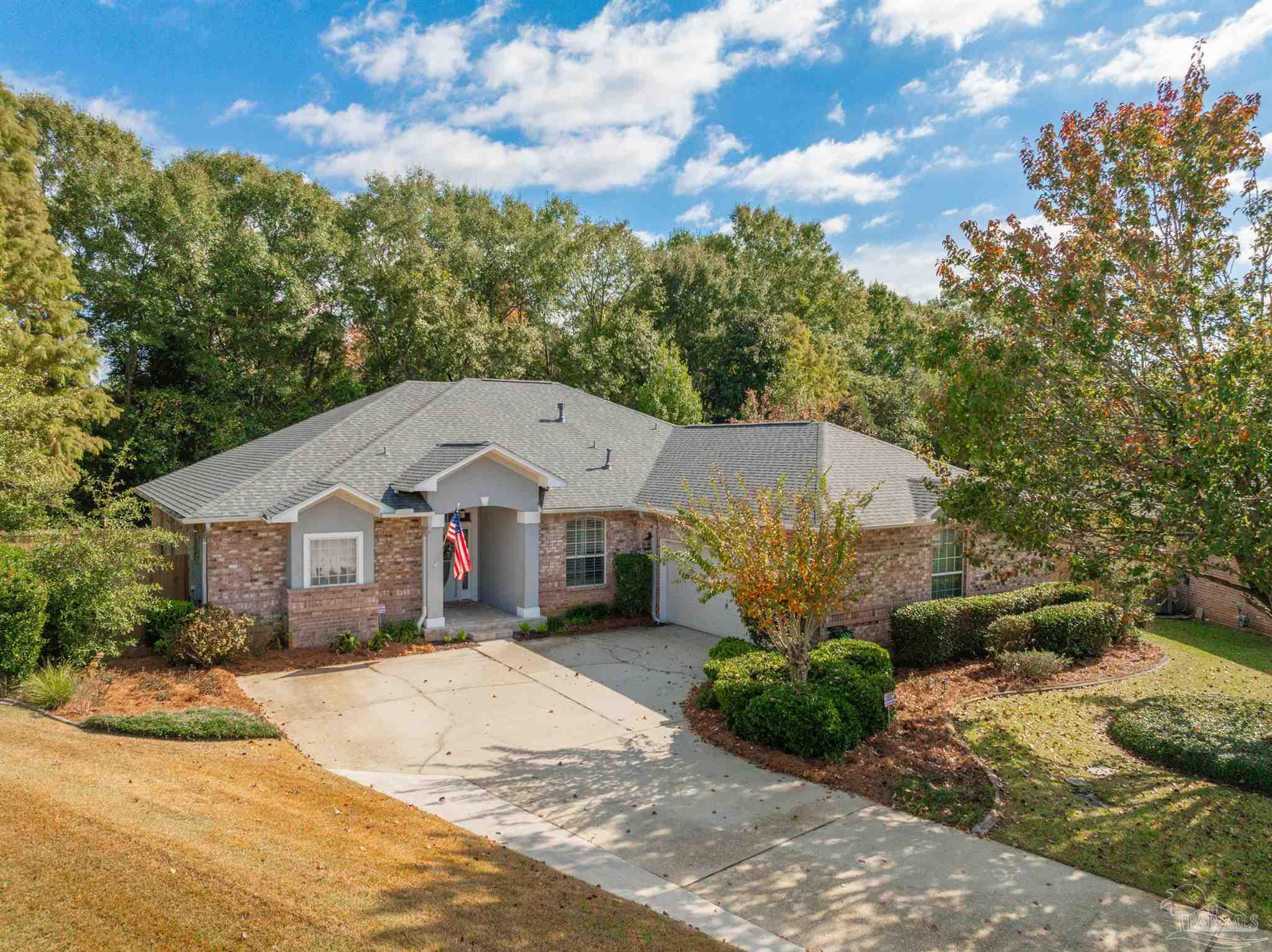 2351 Queens Ferry Lane Cantonment, FL 32533 - Photo 3 of 67 a front view of a house with a garden