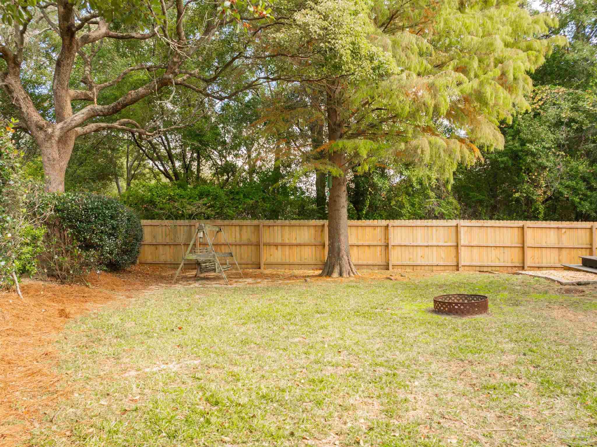 2351 Queens Ferry Lane Cantonment, FL 32533 - Photo 58 of 67 a view of a yard with a tree