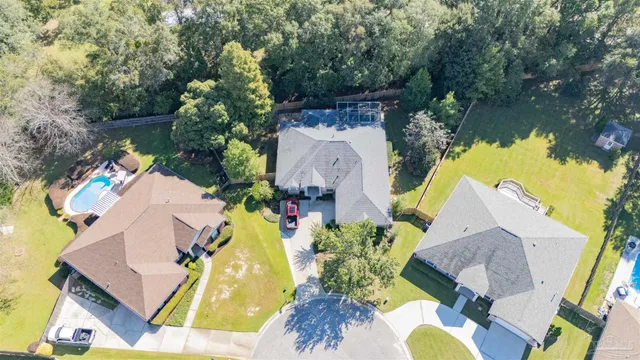 a view of swimming pool with a patio and a garden