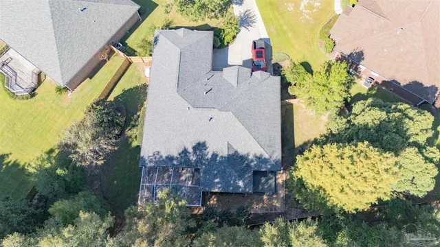 a aerial view of a house with swimming pool