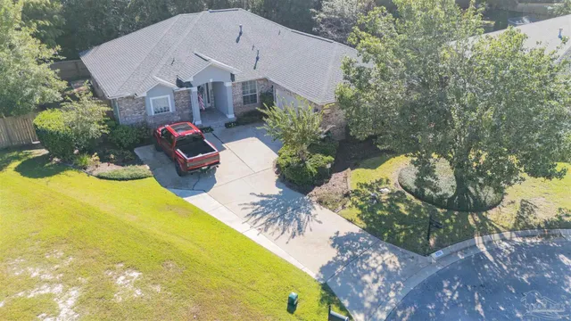 an aerial view of a house with outdoor space