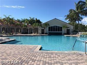 9387 Springview Loop Estero, FL 33928 - Photo 30 of 39 a front view of a house with garden