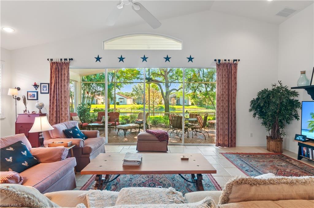 9387 Springview Loop Estero, FL 33928 - Photo 3 of 39 a living room with furniture and a large window