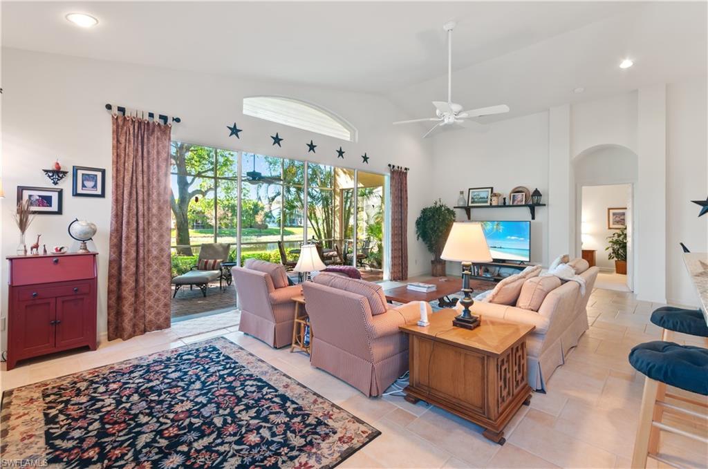 9387 Springview Loop Estero, FL 33928 - Photo 6 of 39 a living room with furniture and a large window