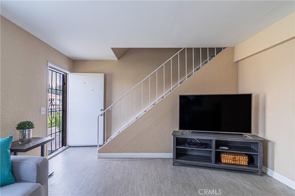 10654 White Oak Drive Riverside, CA 92505 - Photo 6 of 29 a living room with furniture and a flat screen tv