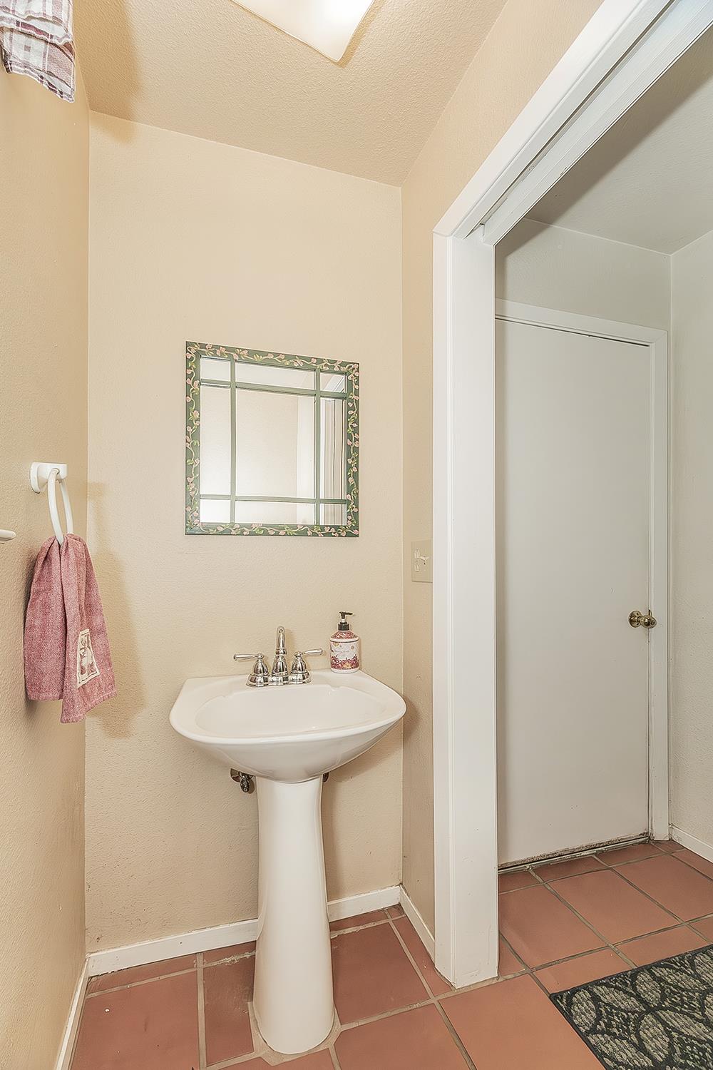 14815 Garlock Lane Prather, CA 93651 - Photo 32 of 80 a bathroom with a sink and a mirror