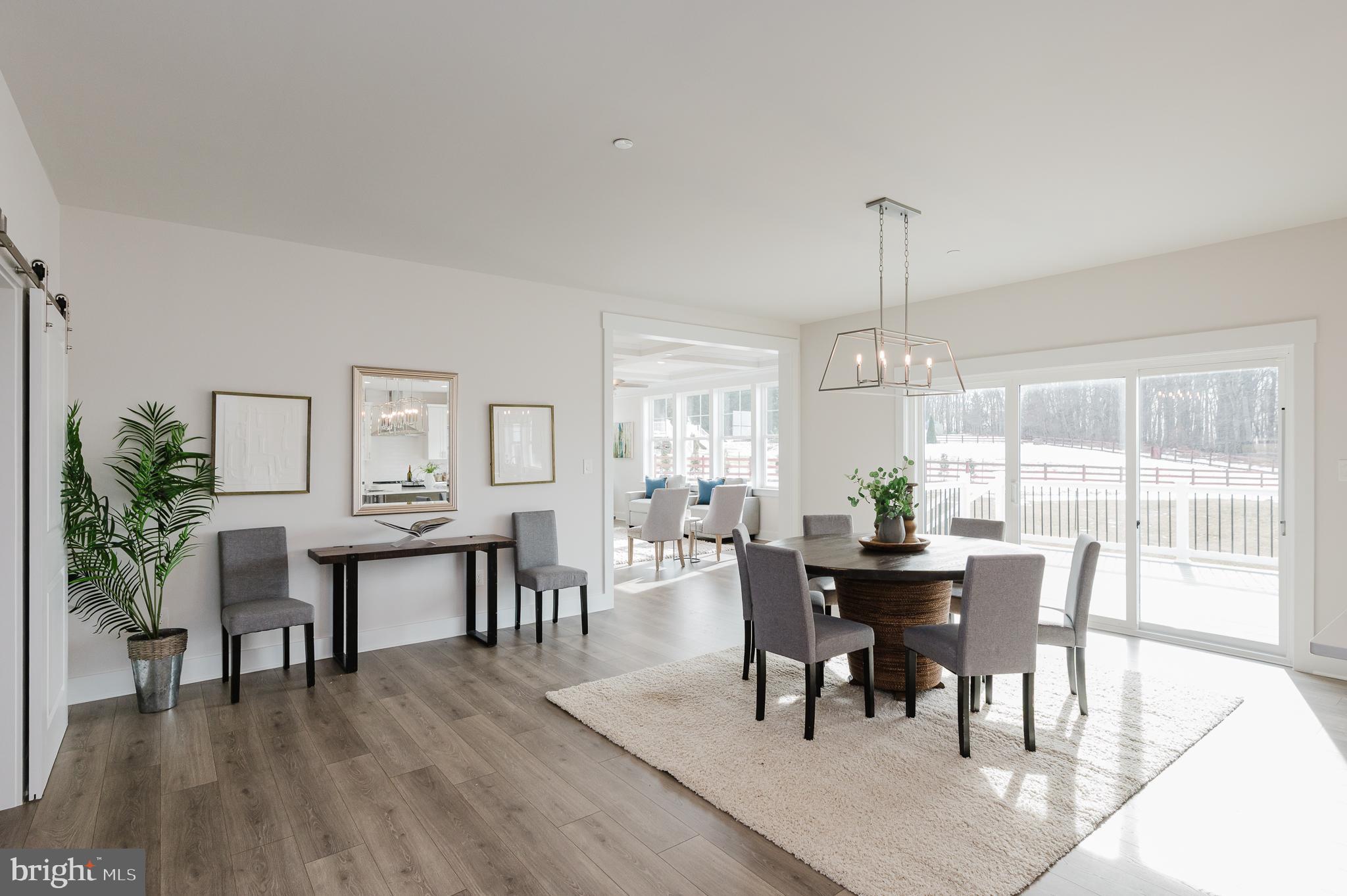 1605 A Oakland Road Freeland, MD 21053 - Photo 12 of 32 a view of a dining room with furniture window and wooden floor