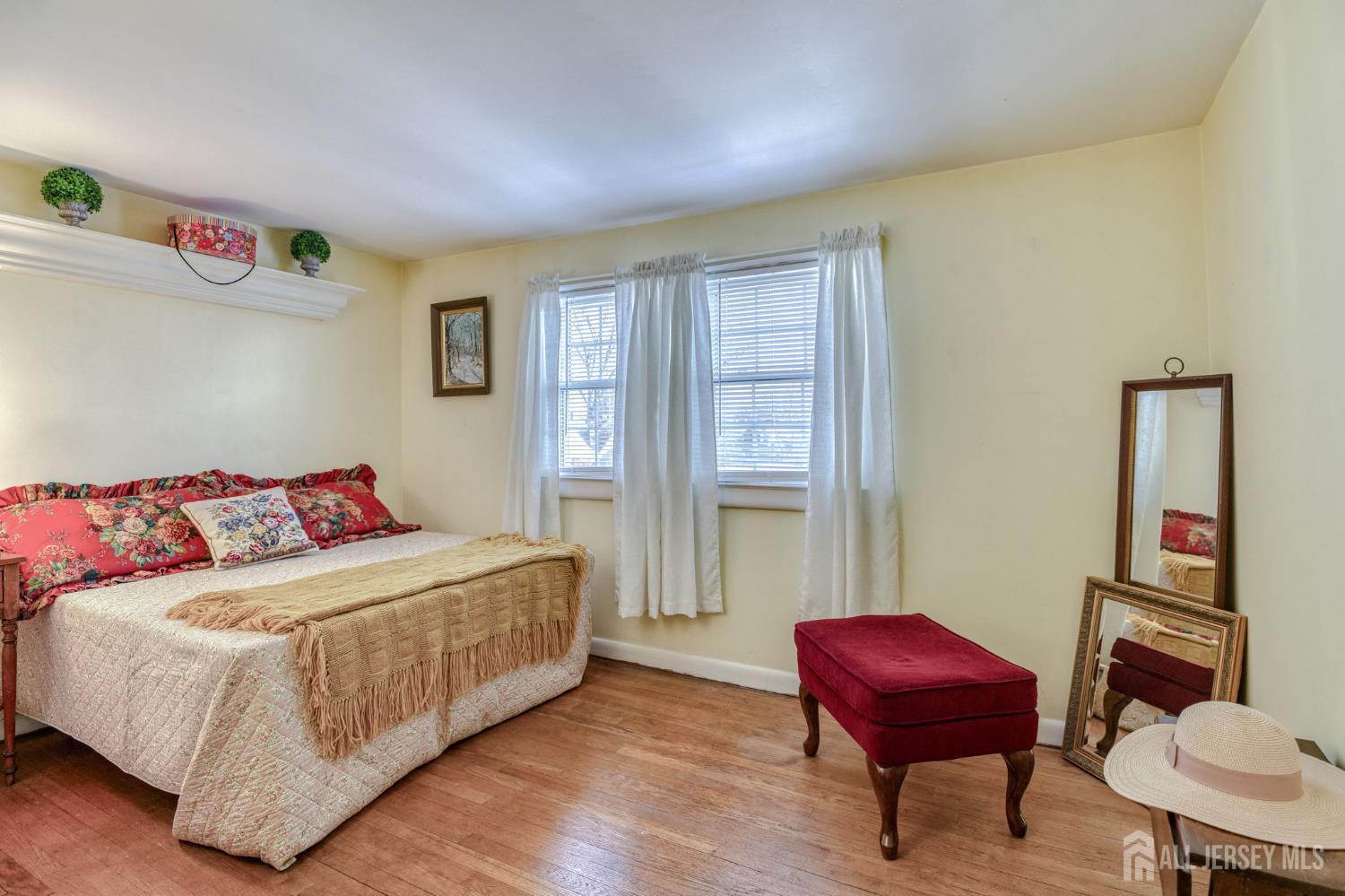 58 Harrison Avenue Milltown, NJ 08850 - Photo 13 of 30 a bedroom with a bed and a chair