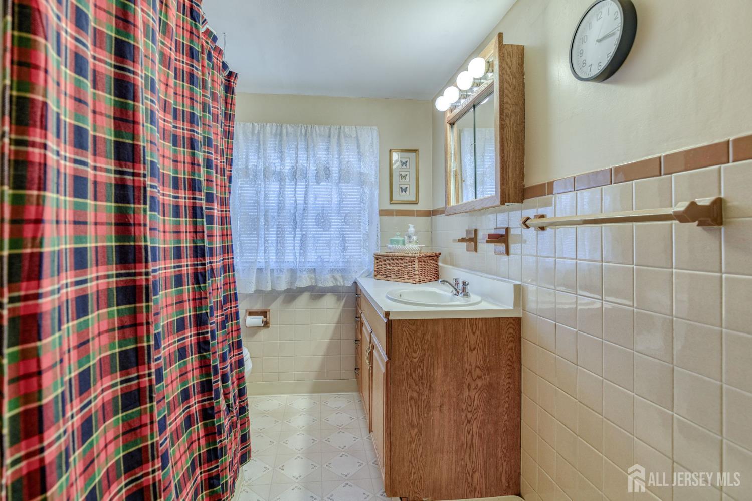 58 Harrison Avenue Milltown, NJ 08850 - Photo 14 of 30 a bathroom with a sink toilet and shower