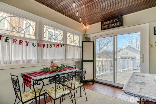 a outdoor dining space with furniture and window