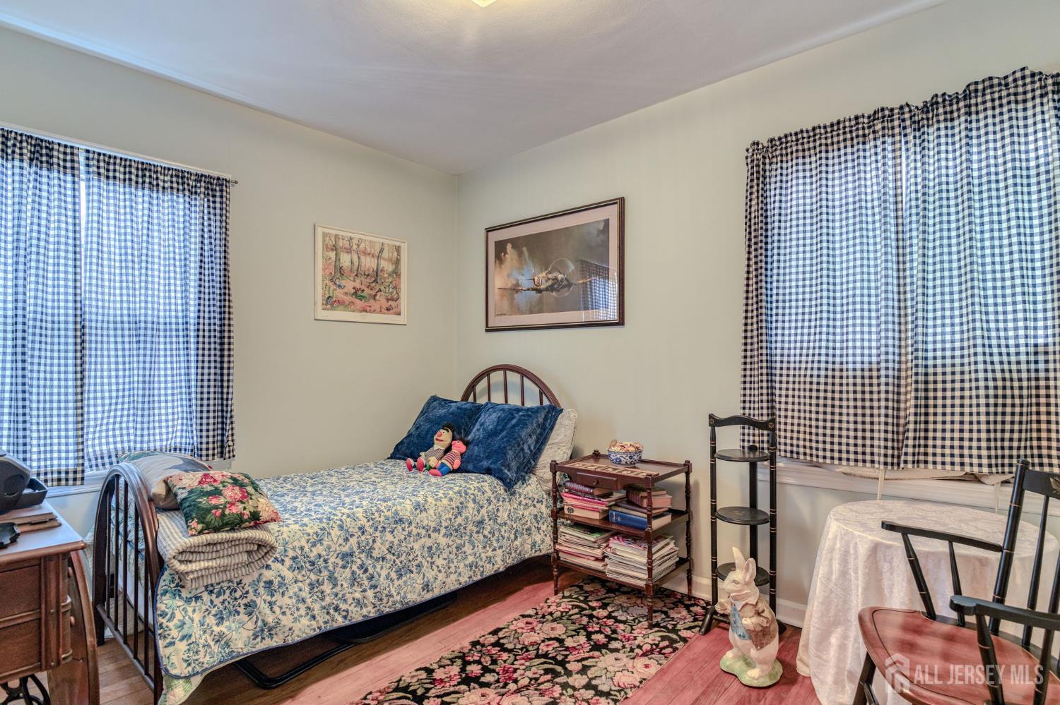 58 Harrison Avenue Milltown, NJ 08850 - Photo 17 of 30 a bedroom with a bed and wooden floor