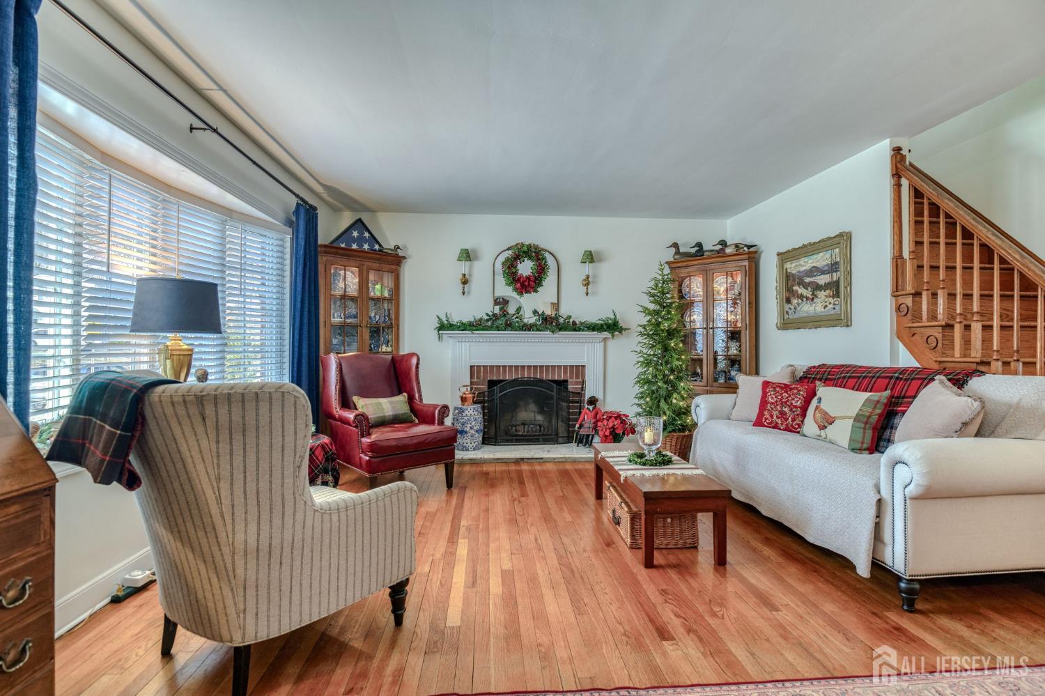 58 Harrison Avenue Milltown, NJ 08850 - Photo 3 of 30 a living room with furniture and a fireplace