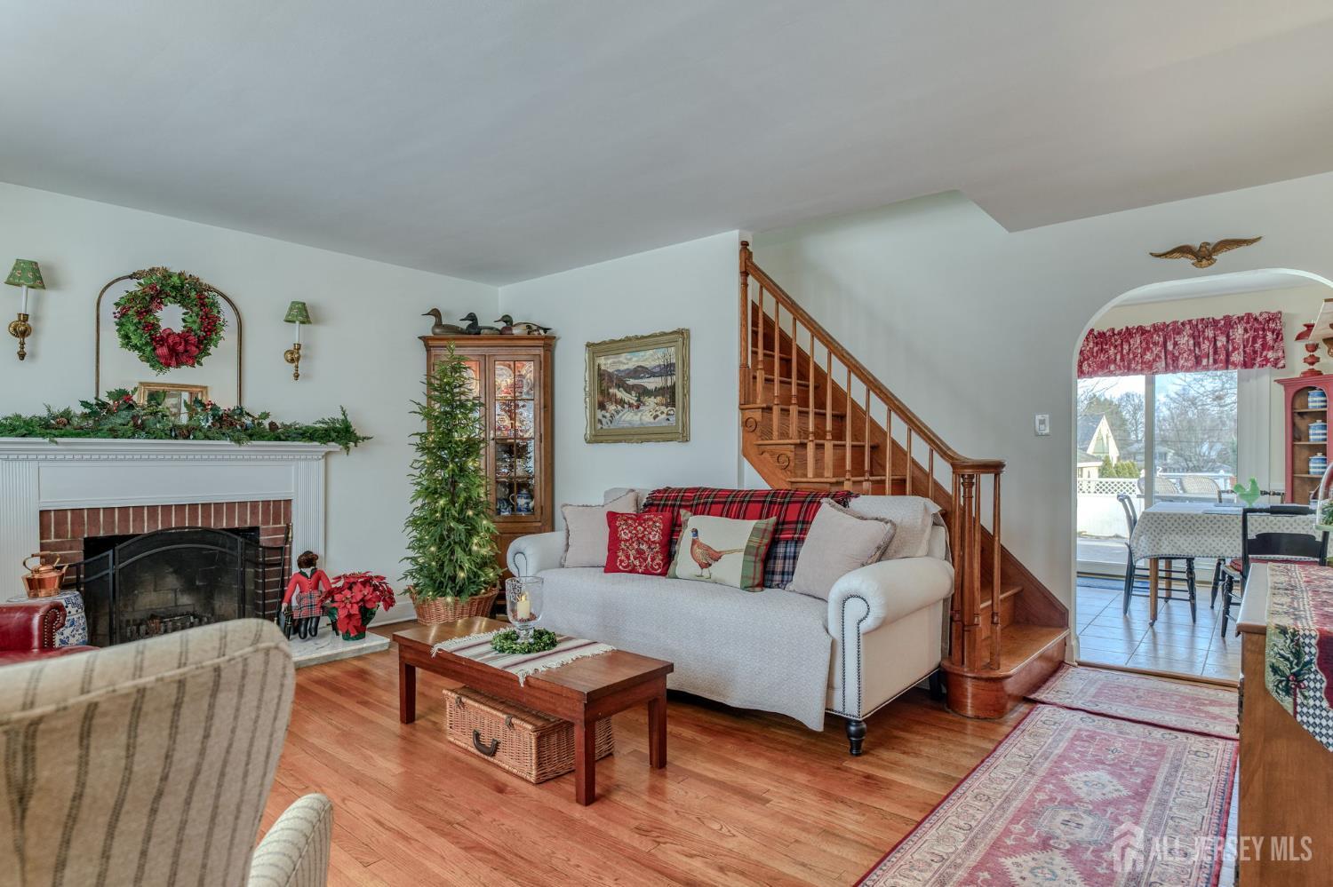 58 Harrison Avenue Milltown, NJ 08850 - Photo 5 of 30 a living room with furniture and a fireplace
