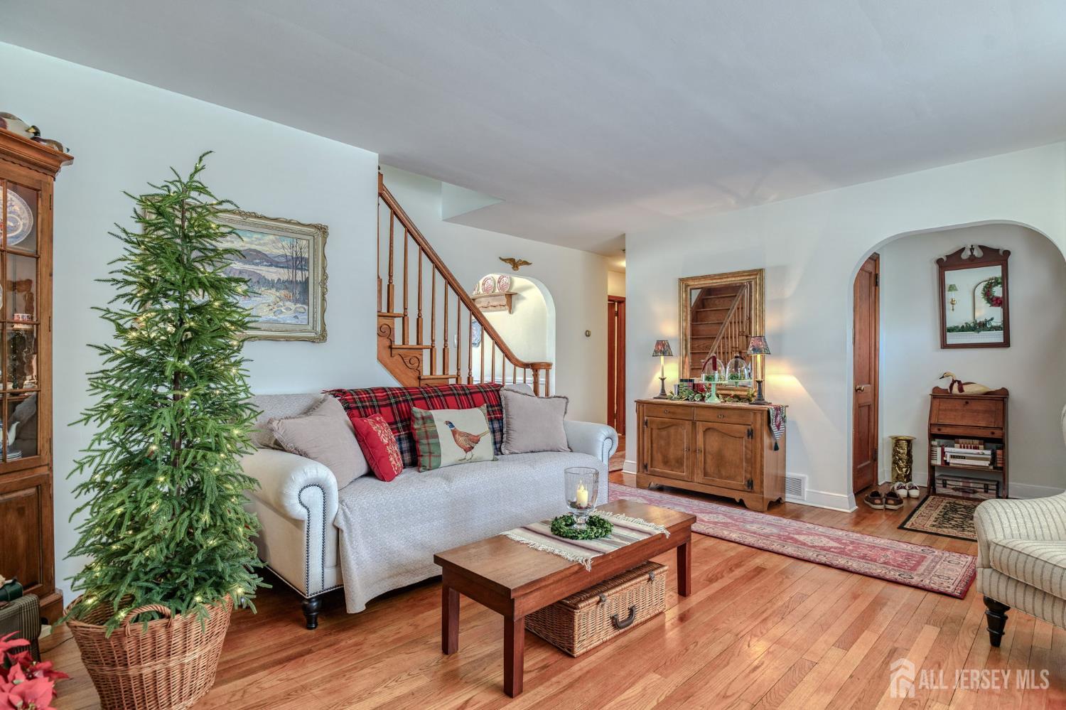 58 Harrison Avenue Milltown, NJ 08850 - Photo 6 of 30 a living room with furniture and a potted plant