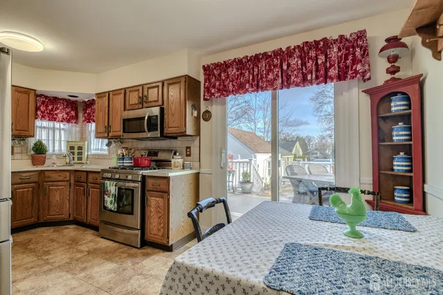 a kitchen with a stove a sink and a microwave