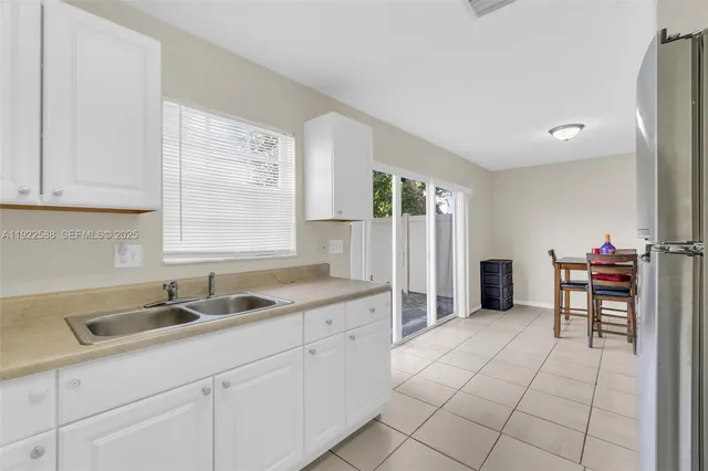 a kitchen with a sink and cabinets