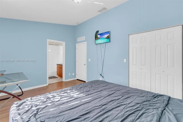 a bedroom with a bed and a table in it